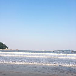 Scenic view of beach against clear sky