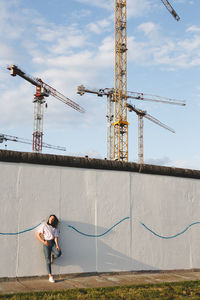 Woman standing against sky