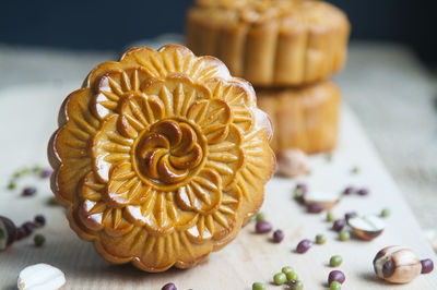 Close-up of moon cakes with seeds on cutting board