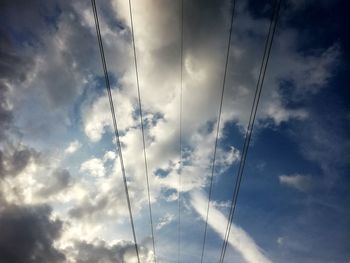 Low angle view of birds against sky