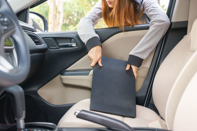 Woman sitting in car