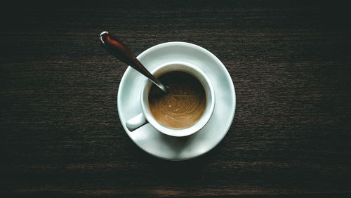 High angle view of coffee cup on table