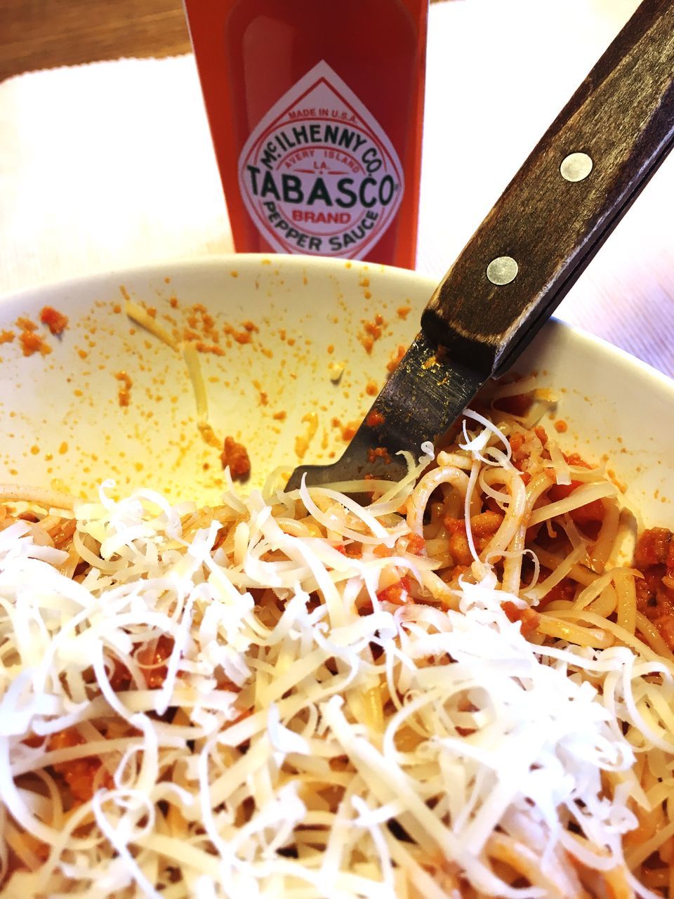 food, food and drink, indoors, close-up, no people, still life, italian food, plate, pasta, wellbeing, shavings, freshness, eating utensil, kitchen utensil, healthy eating, high angle view, table, selective focus, shredded, pizza, chopped, spaghetti