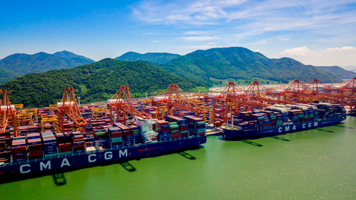 Panoramic view of commercial dock against sky