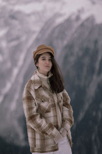 Full length of girl standing in snow