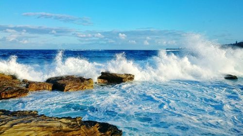 Waves splashing on rocks