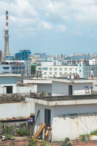 High angle view of buildings against sky in city