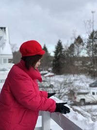 Midsection of woman standing in park during winter