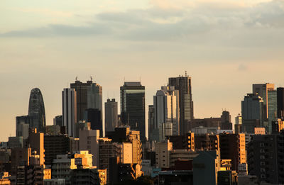 View of cityscape against sky during sunset