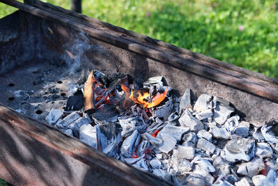 Close-up of firewood on barbecue grill