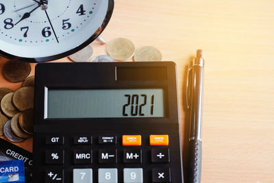 High angle view of clock on table