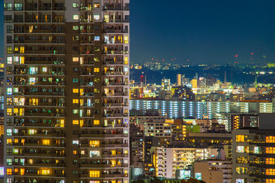 Illuminated buildings in city at night