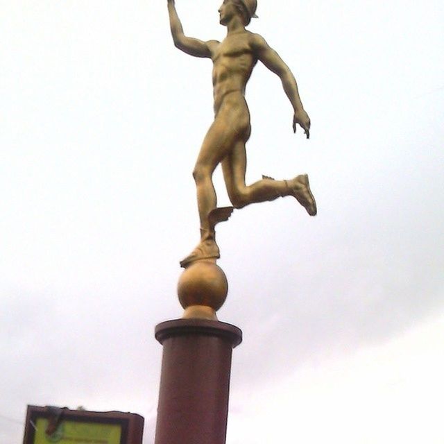 low angle view, sky, clear sky, metal, close-up, no people, day, outdoors, pole, copy space, part of, built structure, metallic, sculpture, street light, cloud, architecture, focus on foreground, statue, architectural column