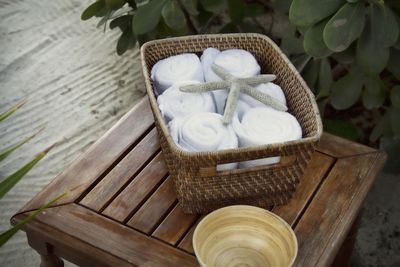 High angle view of starfish on towels in basket