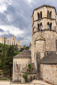 View of the watchtower, in the background is the cathedral of st. mary, girona, catalonia, spain.