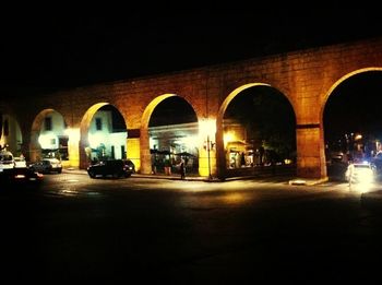 View of illuminated road at night