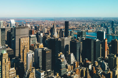 Aerial view of modern buildings in city against sky