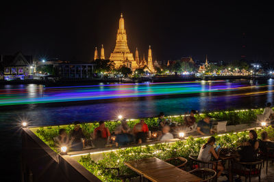 Illuminated buildings in city at night