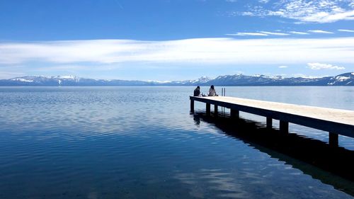 Pier over lake against sky