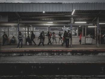 People waiting at railroad station platform