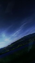 Scenic view of landscape against sky at night