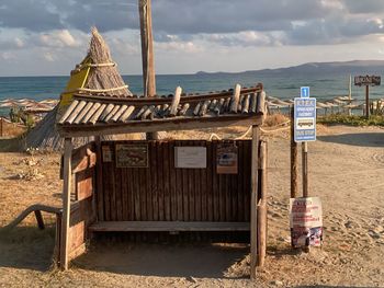 Built structure on beach against sky