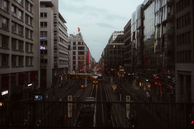 Cars on street amidst buildings in city