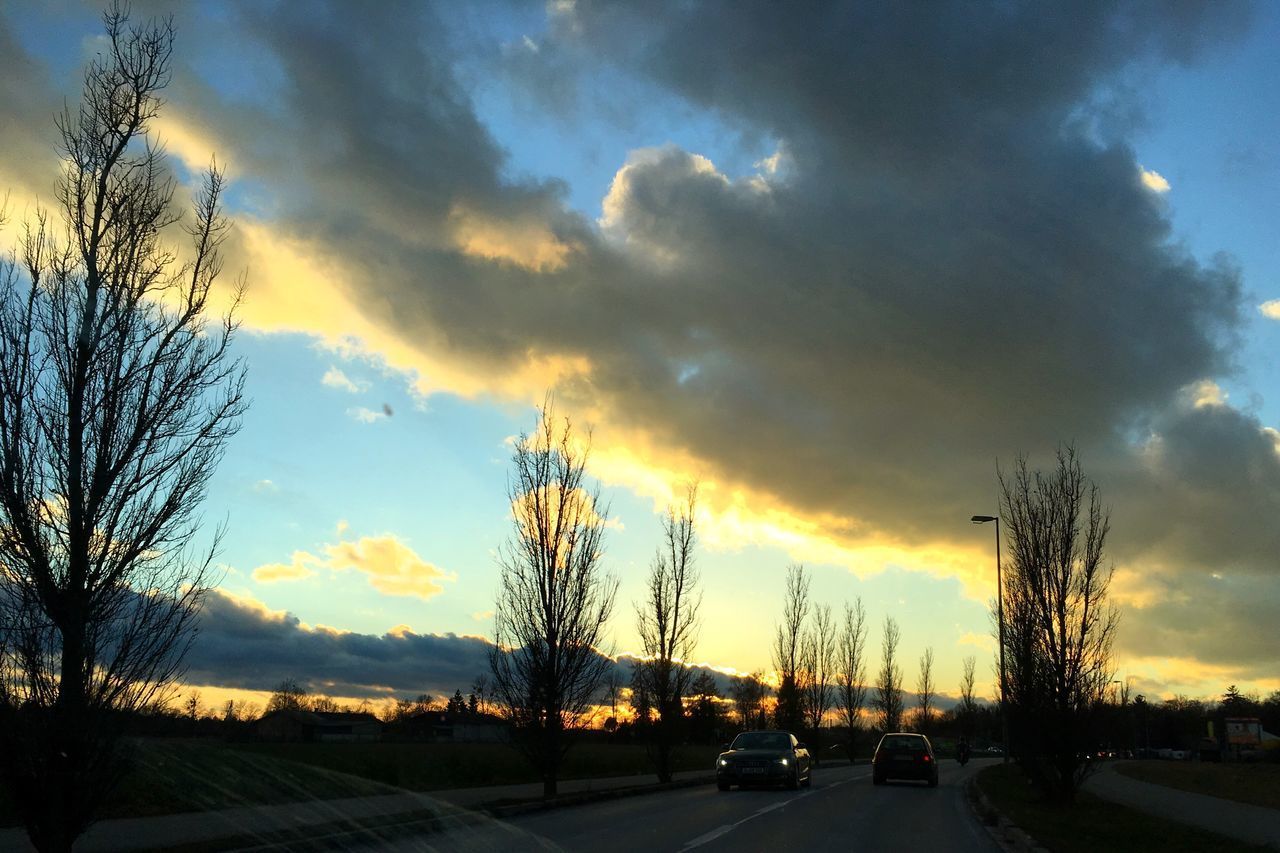 VIEW OF ROAD AGAINST DRAMATIC SKY