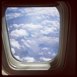 Scenic view of landscape seen through airplane window