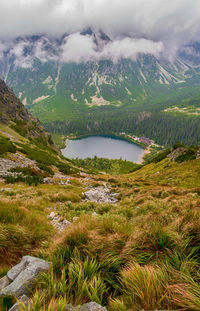 Scenic view of lake and mountains against sky