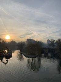 Scenic view of river against sky during sunset