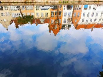 High angle view of buildings by lake in city