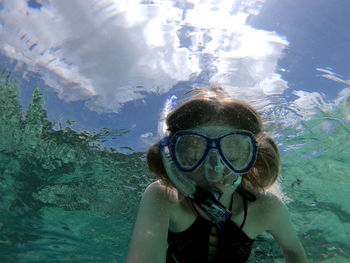 Portrait of woman swimming in sea