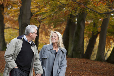 Senior couple walking through park, gothenburg, sweden