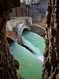 Scenic view of river flowing through arch