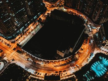 High angle view of illuminated buildings in city at night