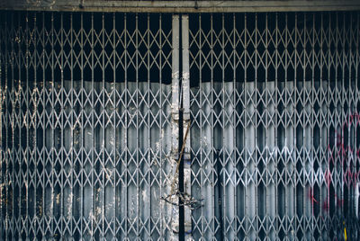 Full frame shot of metal fence against building