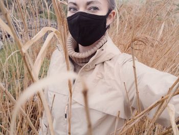 Portrait of man standing on field