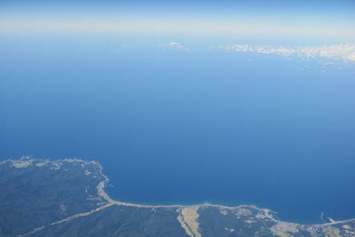 Scenic view of sea against blue sky