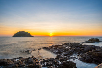 Scenic view of sea against sky during sunset