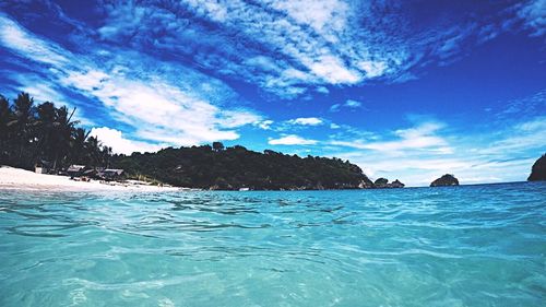 Scenic view of sea against blue sky