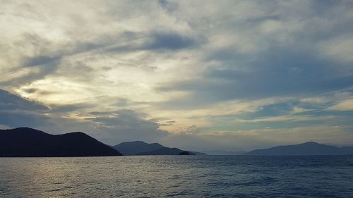 Scenic view of sea against dramatic sky