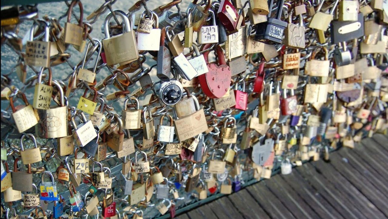 abundance, large group of objects, love, metal, padlock, lock, connection, hanging, railing, bridge - man made structure, tradition, attached, wishing, outdoors, day, wish, no people, culture