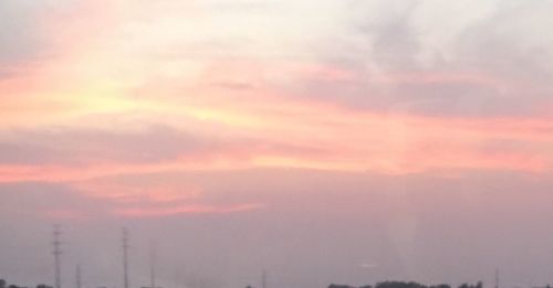 Low angle view of cloudy sky at sunset