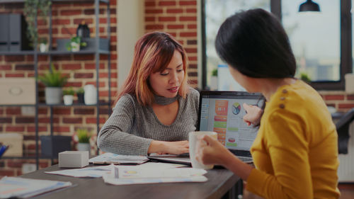 Colleagues working at office