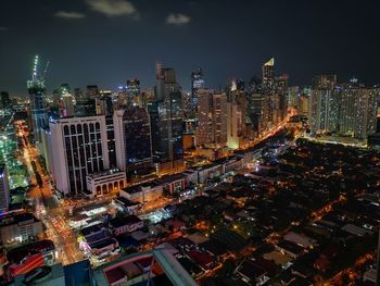 High angle view of illuminated buildings in city at night