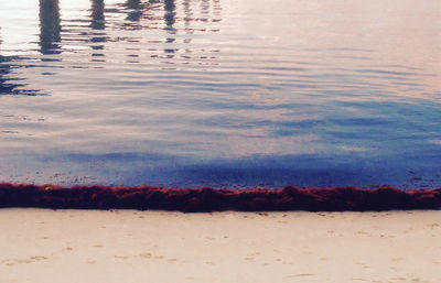 High angle view of beach against sky during sunset