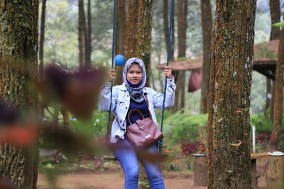 Full length portrait in forest