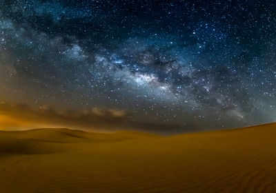 Scenic view of sea against sky at night