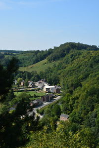 High angle view of houses and trees against sky